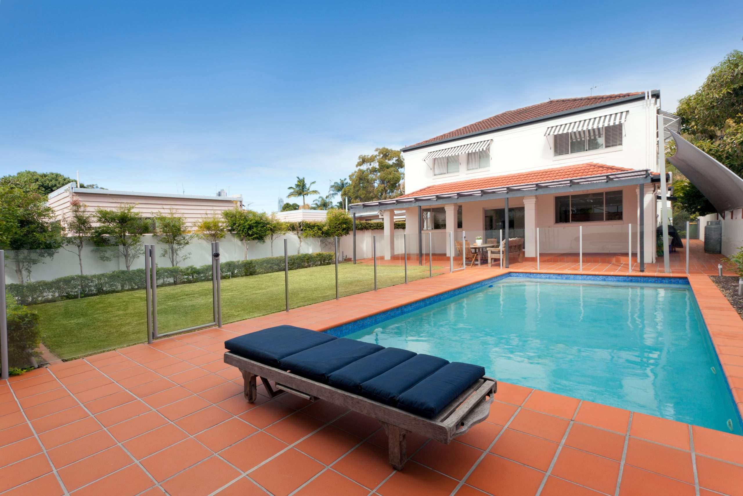 Modern backyard with pool and patio seating